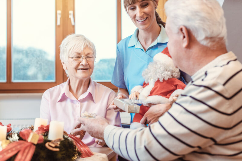 seniors with terminal illness celebrating the holidays in an assisted living facility