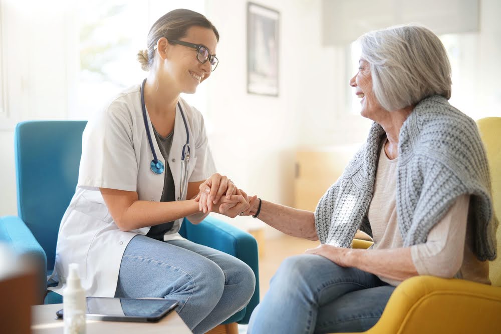A woman meeting with a hospice doctor to discuss quality of life and supportive care options